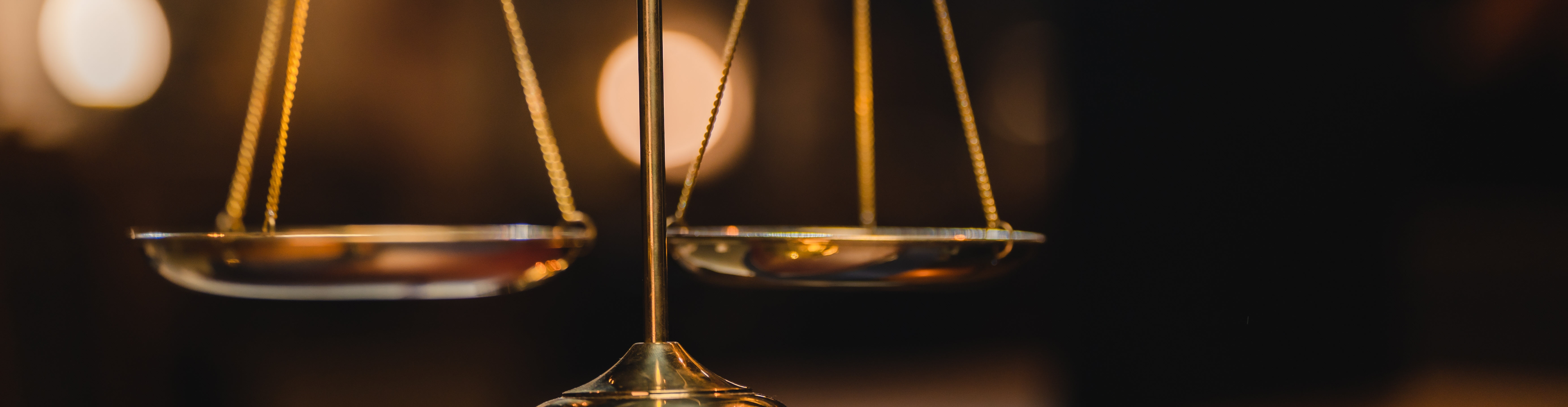 close up image of the scales of justice